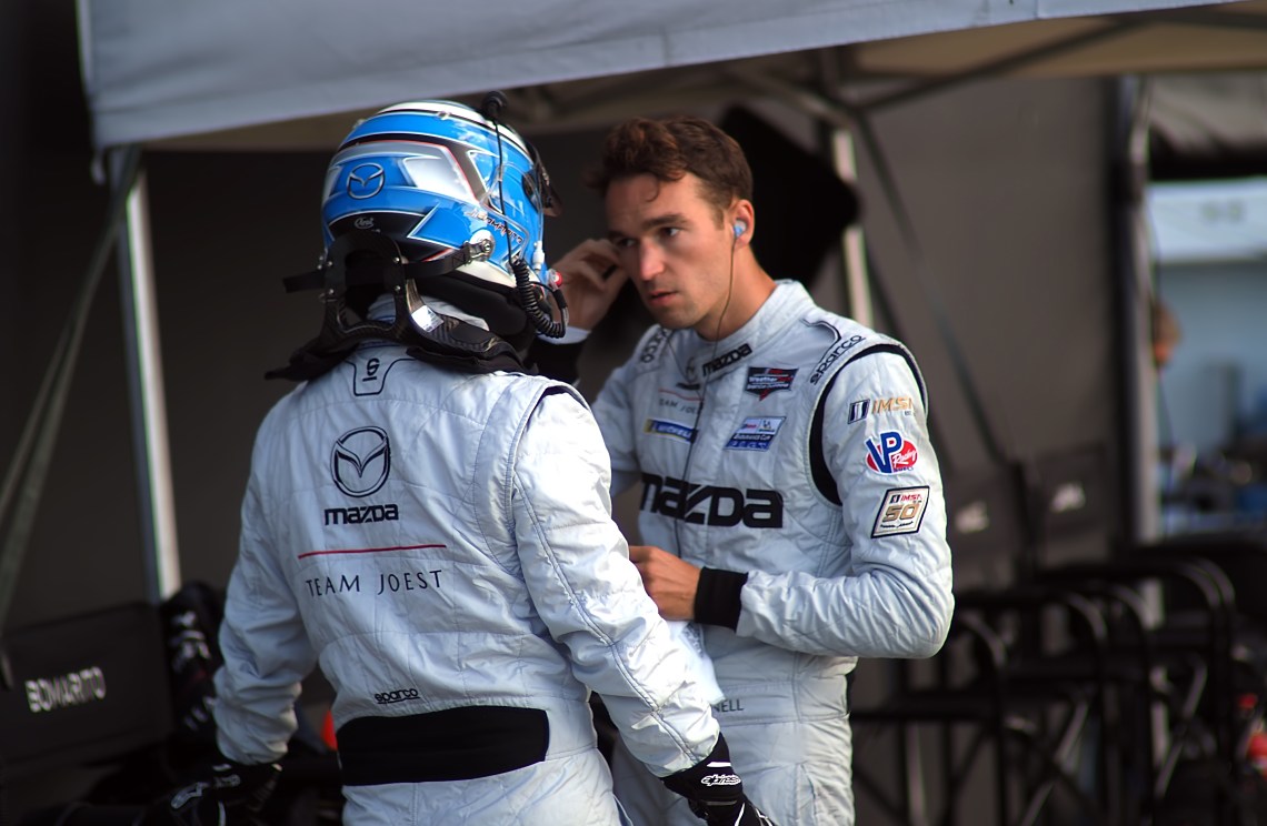 Mazda #55 drivers plan race strategy.